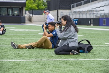 Students taking pictures in Wild About Photography course